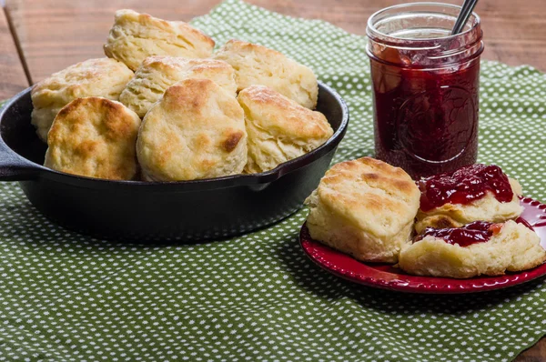 Fresh baked biscuits and jam or preserves — Stock Photo, Image