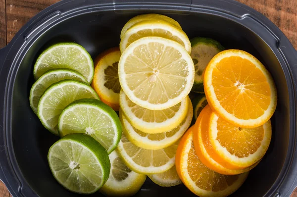 Bowl with lemon, lime and orange — Stock Photo, Image