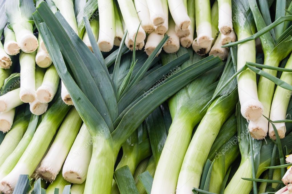 Fresh leeks on display at the market — Stock Photo © zigzagmtart 70103449