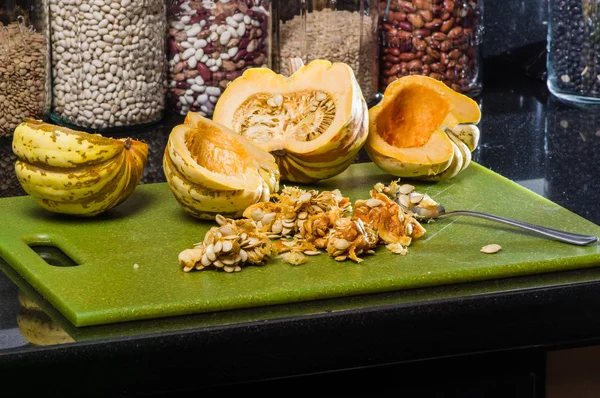 Winter squash hollowed out to cook with seeds — Stock Photo, Image