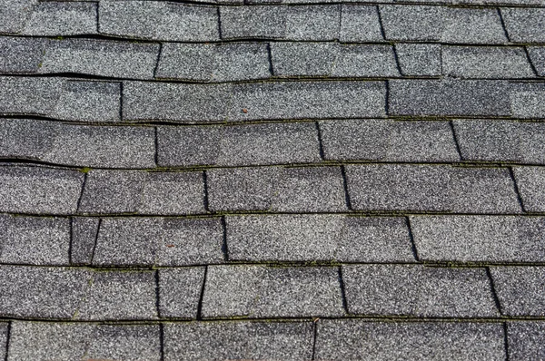 Composition shingles on a roof showing detail — Stock Photo, Image