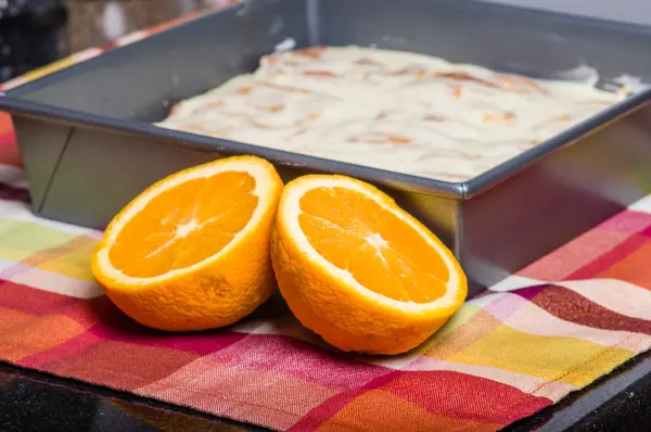 Oranges with fresh sweet rolls — Stock Photo, Image