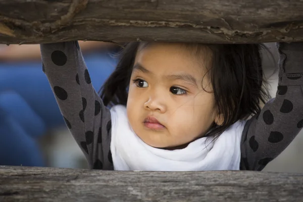 Asian baby behind the windows — Stock Photo, Image