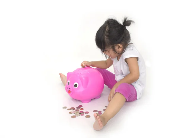Aziatische kinderen met roze piggy bank — Stockfoto