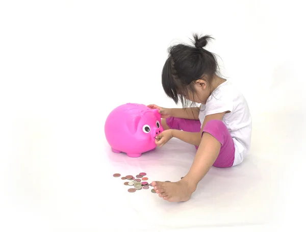 Aziatische kinderen met roze piggy bank — Stockfoto