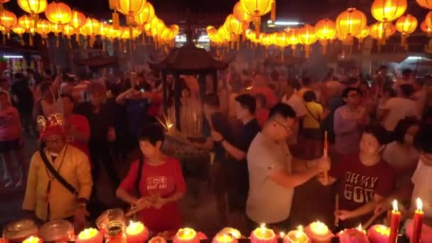 Devotees burn incense stick and candle pray for deities — Stock Video