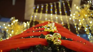 Christmas ball decoration at mall with colorful lighting.
