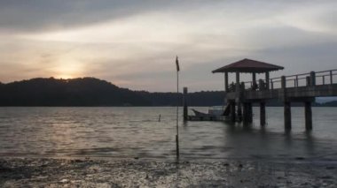 Gün batımı Jetty Batu Musang.