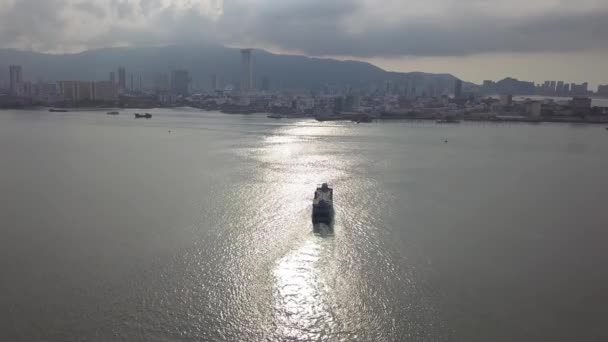Drone shot Penang ferry move at sea under sun light. — Stock Video