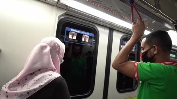 People wear mask in LRT train — Stock Video