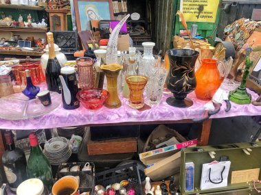 March 27, 2021, Ukraine, Kharkov. Swap meet, sale of old things. Glass vintage vases and stands. open-air flea market.