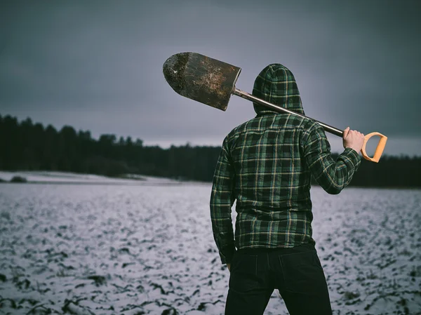 Man och spade — Stockfoto