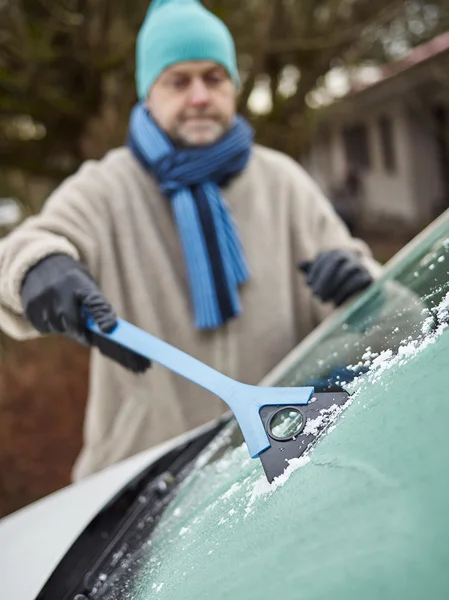 Male and ice scraper — Stock Photo, Image