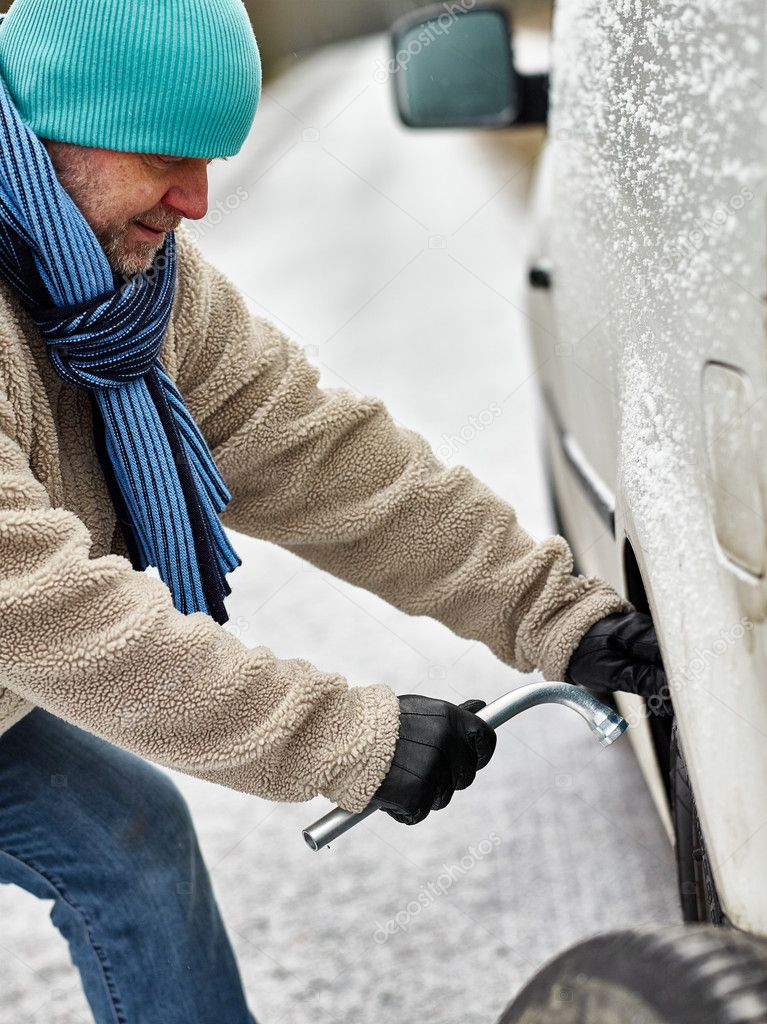 Male and tire exchange Stock Photo by ©jarih 60936619