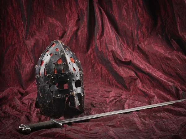 Medieval helmet and sword — Stock Photo, Image