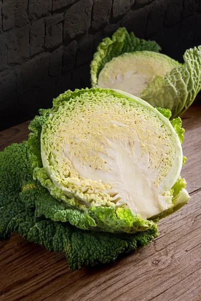 Savoy cabbage on wooden — Stock Photo, Image