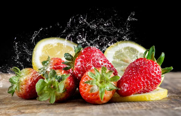 Strawberries and lemon — Stock Photo, Image