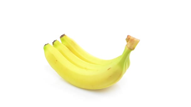 Bananas rotating on white background — Stock Video