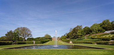 Bathing Pond fountain and the Long walk at The Newt, near Bruton, Somerset, UK on 15 June 2021