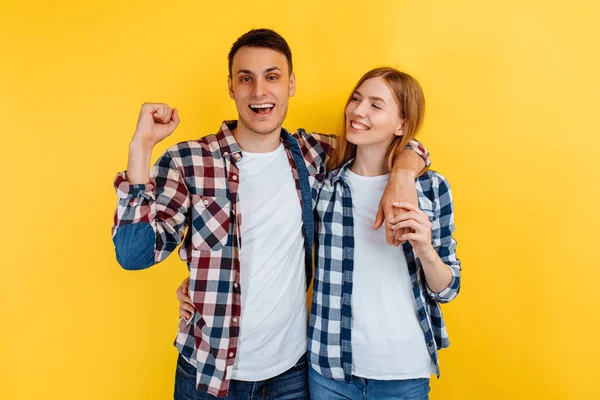 Shocked Young Man Woman Checkered Shirts White Shirts Celebrate Victory — Stock Photo, Image