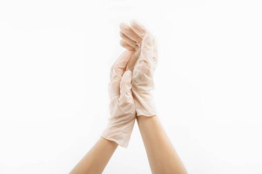 Medical nitrile gloves, a human hand wears a latex glove. Doctor or nurse putting on protective gloves, on isolated white background
