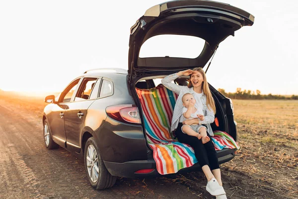 Family holiday and travel concept, summer vacation, happy family, mom and child enjoying the trip by car