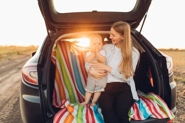 Family holiday and travel concept, summer vacation, happy family, mom and child enjoying the trip by car
