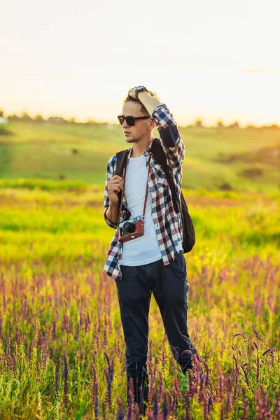 Young Male Tourist Sunglasses Camera Nature Spending Time Hike Field — Stock Photo, Image