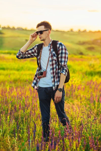 Young Male Tourist Sunglasses Camera Nature Spending Time Hike Field — Stock Photo, Image