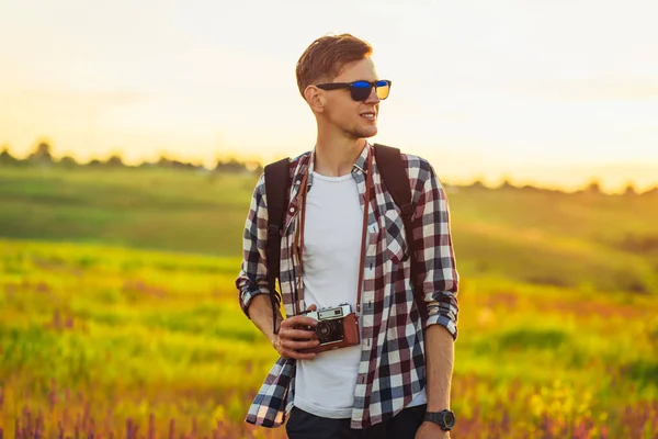 Young Male Tourist Sunglasses Camera Nature Spending Time Hike Field — Stock Photo, Image