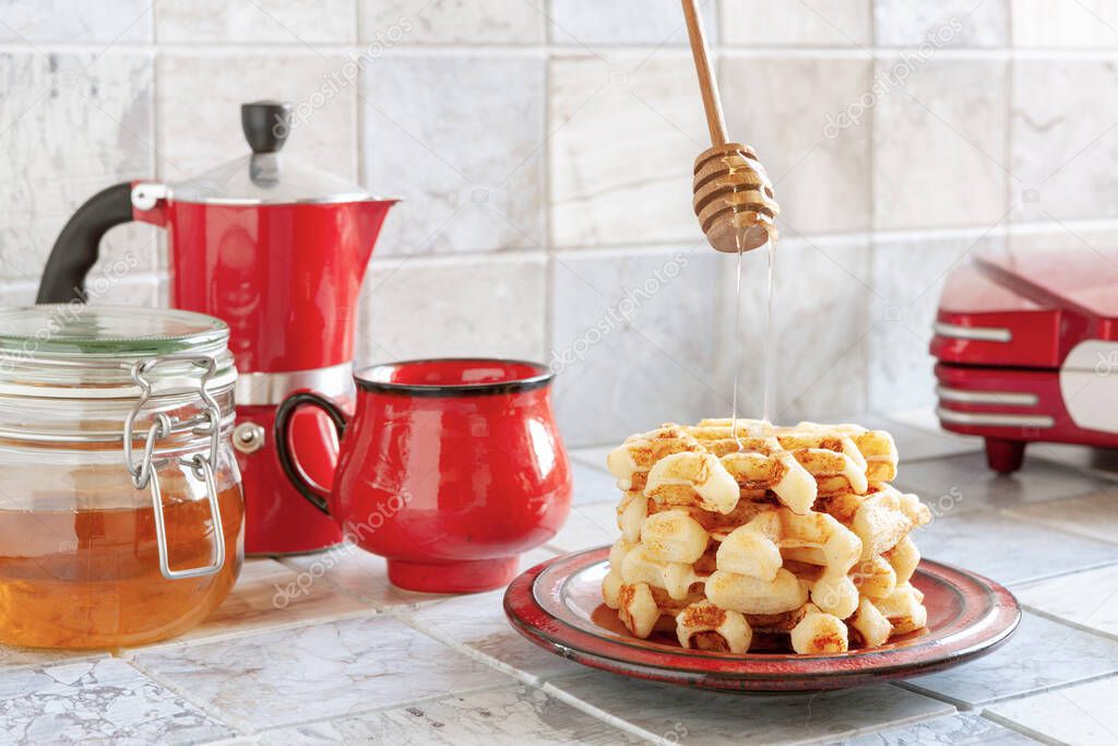 Close-up of soft Viennese waffles on the plate with Hot Honey.