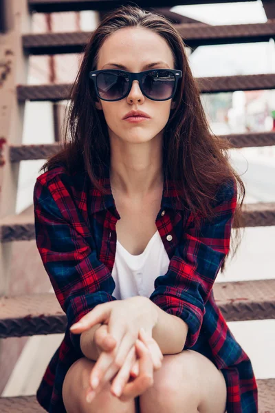 Hipster girl on metal stairs. — Stock Photo, Image