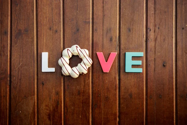 Word love on the wooden table — Stock Photo, Image