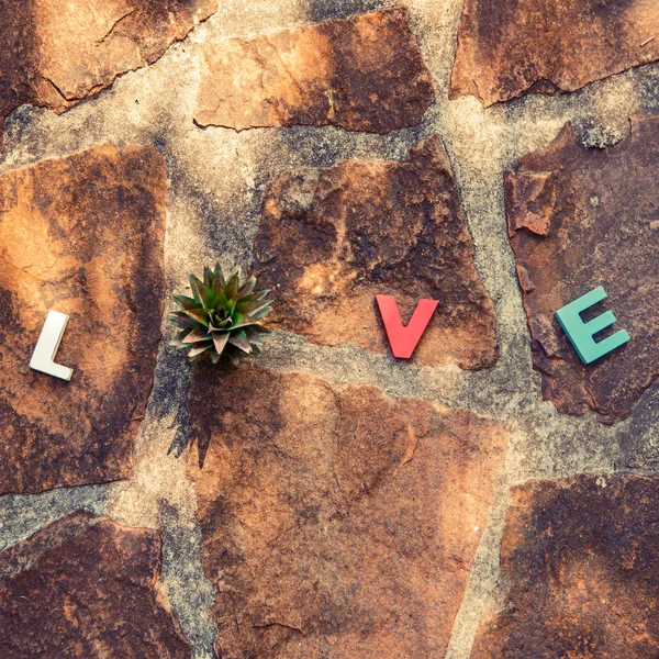 Word love on the stone floor — Stock Photo, Image