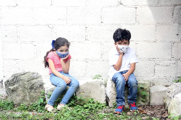 Year Old Latino Children Covid Face Masks Sitting White Wall — Stock Photo, Image