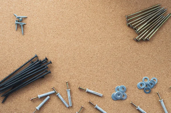 Repair. Screws and washers on the desktop. The concept of a repair shop. Close-up.