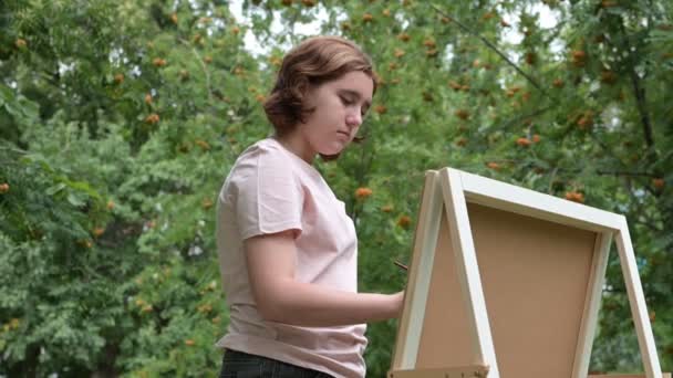 Teenage Girl Red Hair Draws Brush Easel Painting Nature Concept — Stock Video