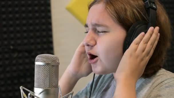 Teenage Girl Headphones Sings Song Recording Music Studio Microphone Video — Stock Video