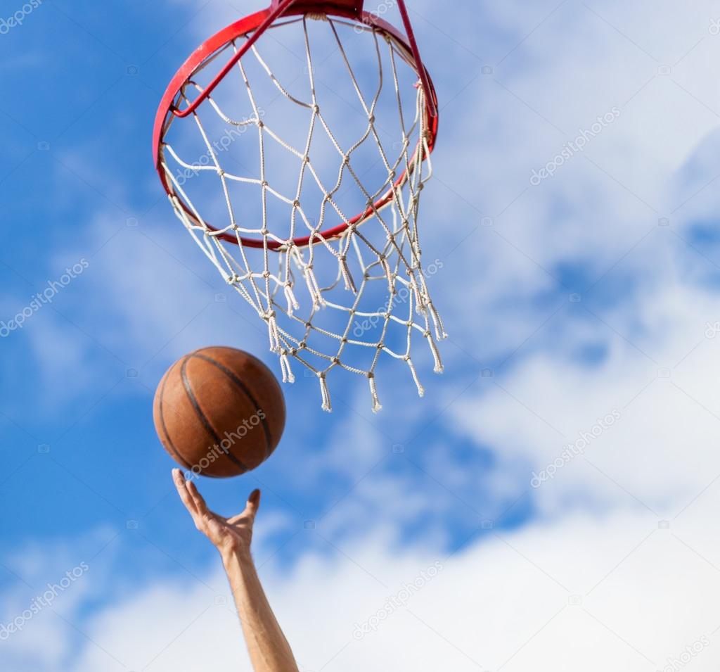 Hands throwing basketball ball into basket ⬇ Stock Photo, Image by