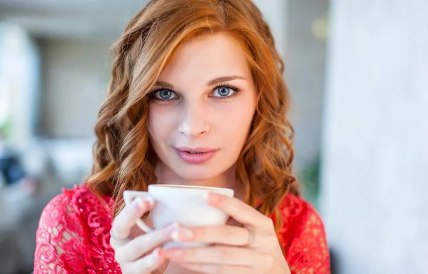 Portrait of happy woman with mug in hands — Stock Photo, Image