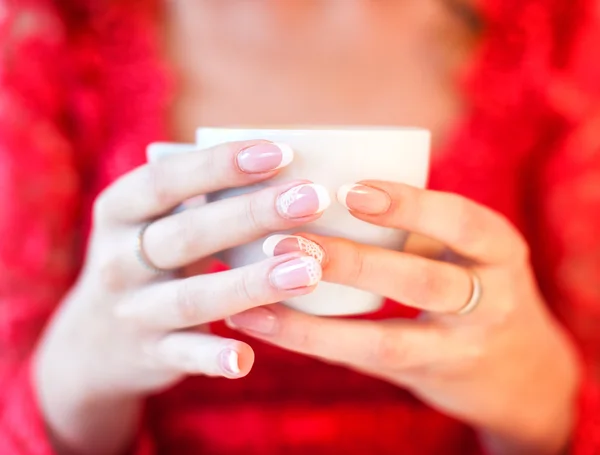 Cup of coffee in womans hands — Stock Photo, Image