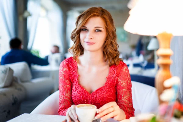 Portrait of happy woman with mug in hands — Stock Photo, Image