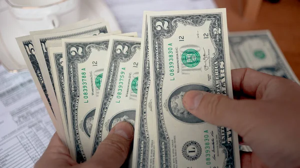 A man counting american dollar bills close-up — Stock Photo, Image