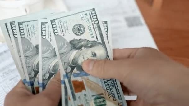 A man counting american dollar bills close-up — Stock Video