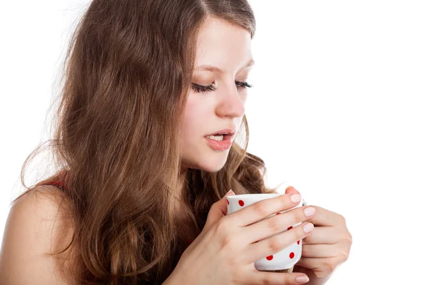 Young girl with a cup of tea in her hands — Stock Photo, Image