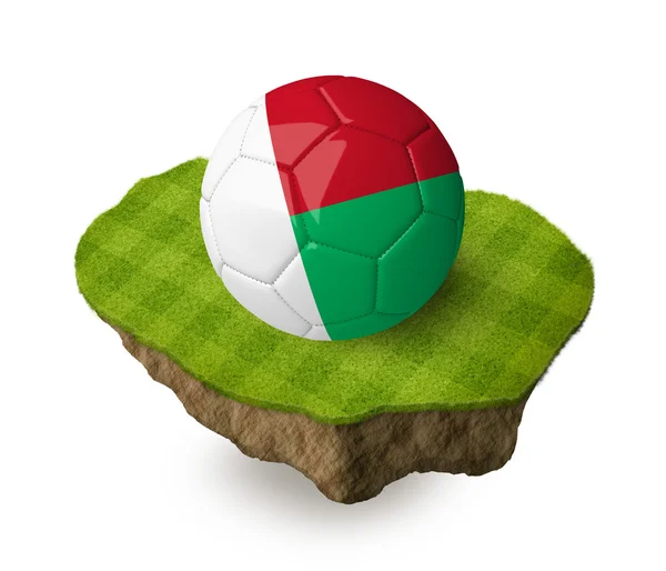 3d realistic soccer ball with the flag of Madagascar on a piece of rock with stripped green soccer field on it. See whole set for other countries. — Stock Photo, Image