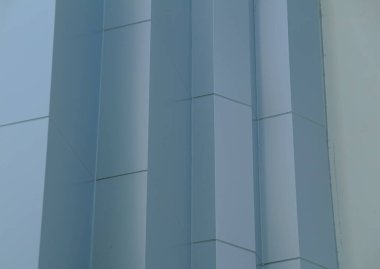 Mavi geometrik bina ön köşe dokusu.