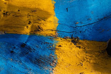 Parlak mavi ve sarı renklerle boyanmış ahşap desen, ahşap tahıl ve dokuyu soyut arka planlar ve renkli tasarımlar için sergiliyor.