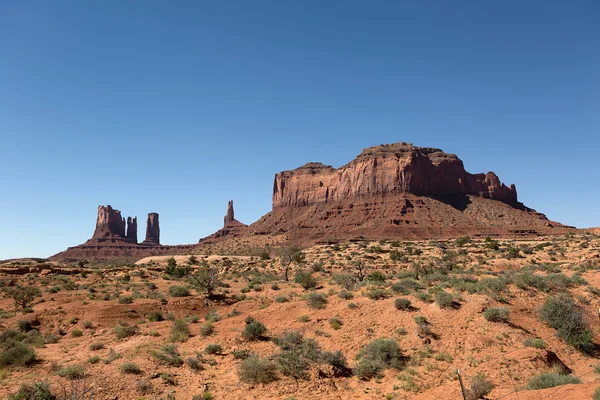 Wind eroded mesa and needles in Monument Valley — Stock Photo, Image