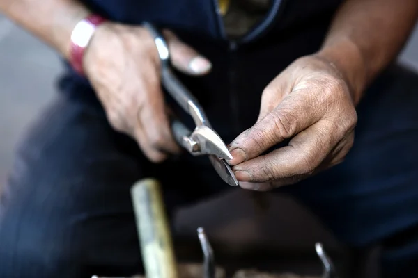 Hands of a coppersmith — Stock Photo, Image